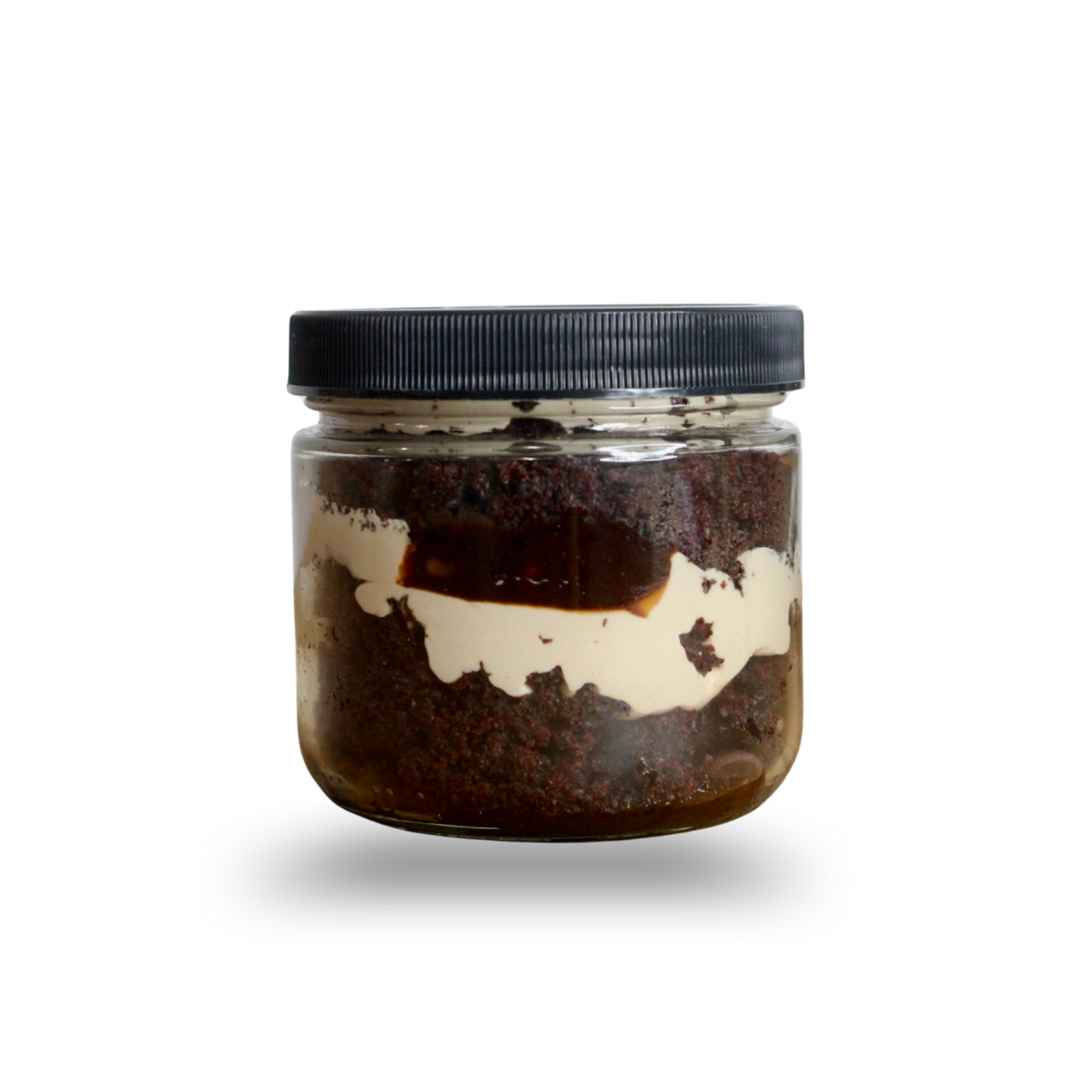 Jar with a black lid containing a dark brown substance on a white background